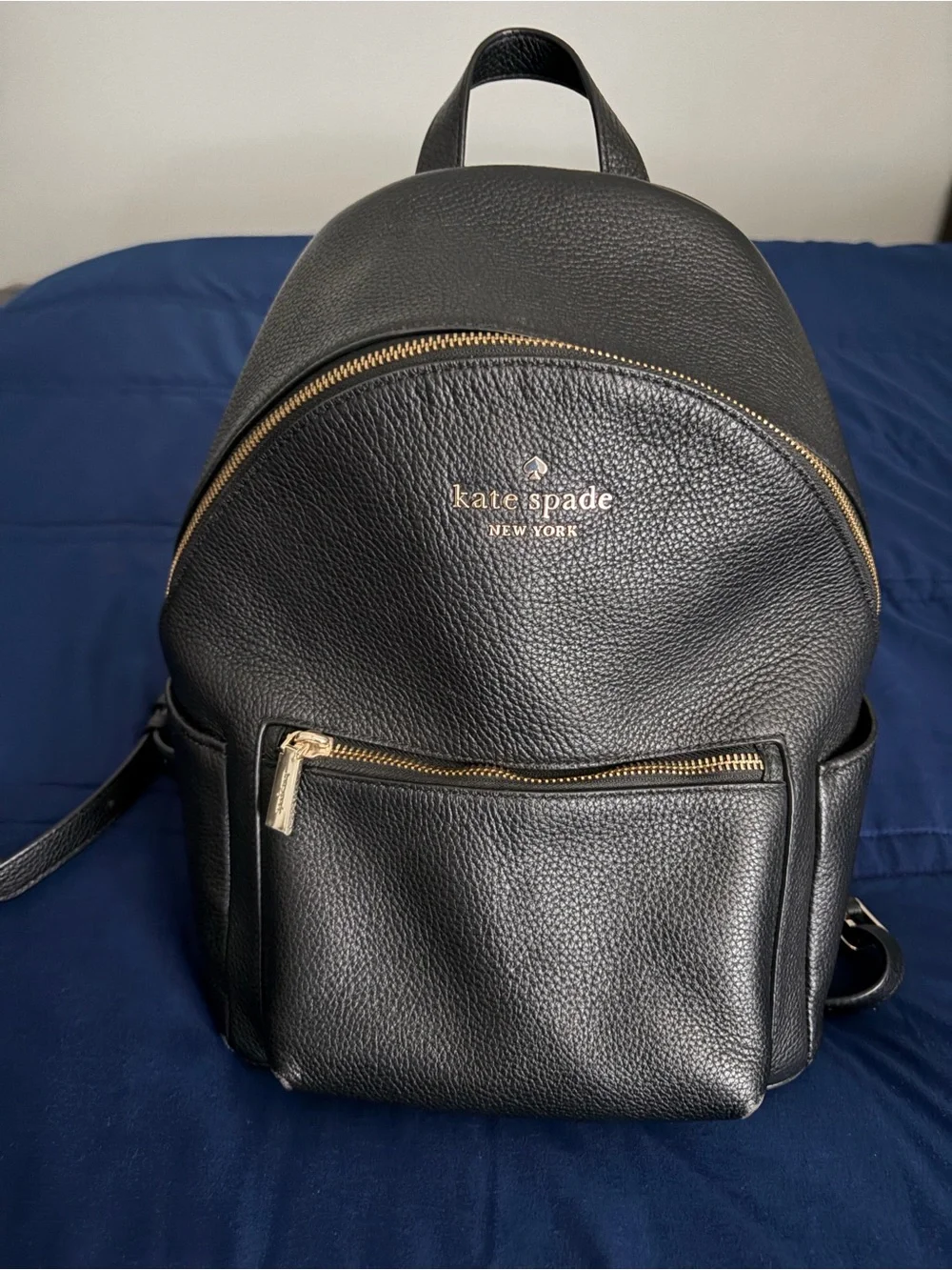 kate spade black pebbled leather backpack with gold accents